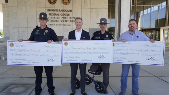 Treasurer Moore Visits Elkins to Present Nearly $40,000 in Unclaimed Property to Local Law Enforcement Agenices